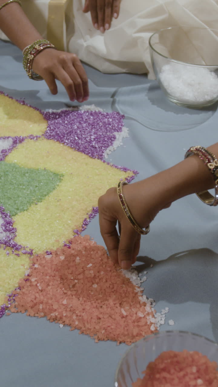 Woman creating rangoli