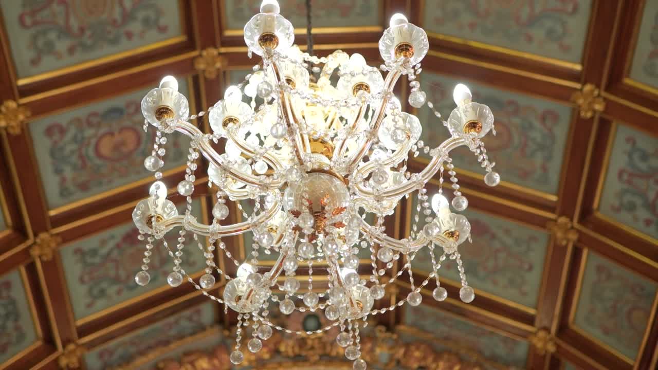 Elegant Church Lamp with Glass Details and Artistic Ceiling Designs in a Christian Church