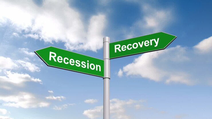 Recession recovery signpost against blue sky