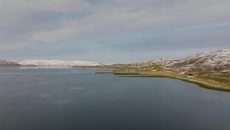 Vast-Fjord-Sea-Landscape-With-Shore-Village-In-Norway,-Aerial