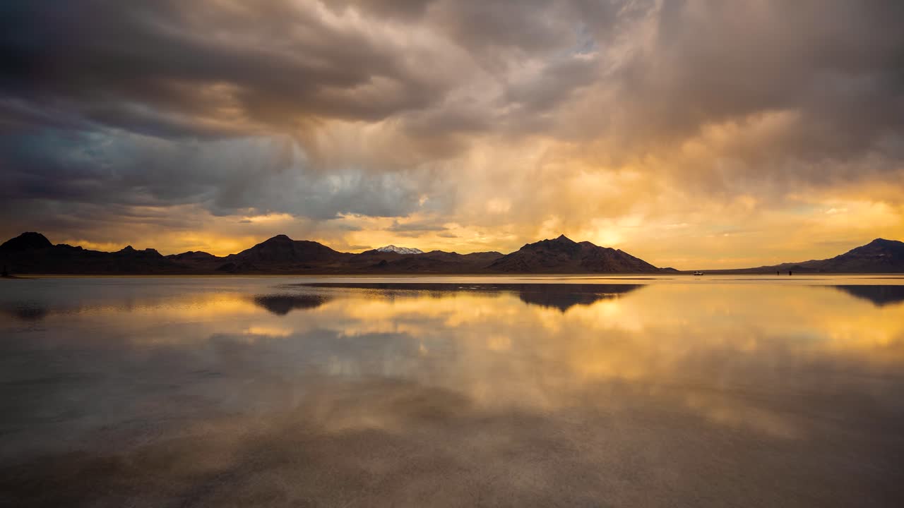 Timelapse, Clouds and Hills Silhouettes Mirror Reflection on Water in Bonneville Salt Flats, Utah USA