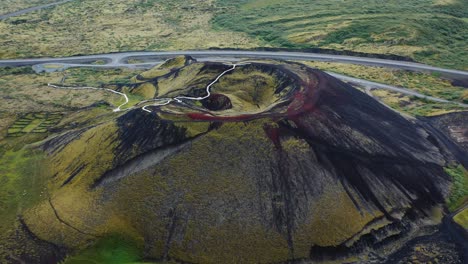 aerial drone flight over grabrok crater, iceland, 4k.