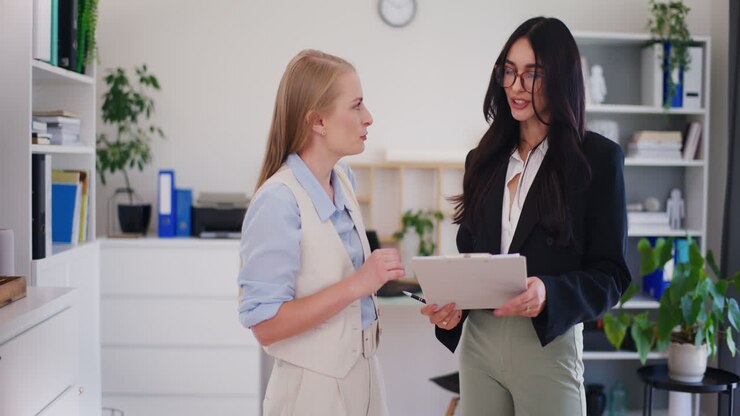 Head of Company Discusses Business Strategy with Worker