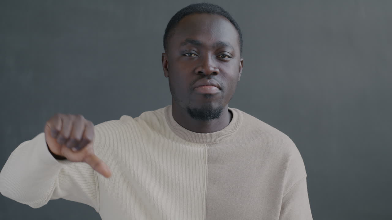 Man with neutral and disapproving expressions