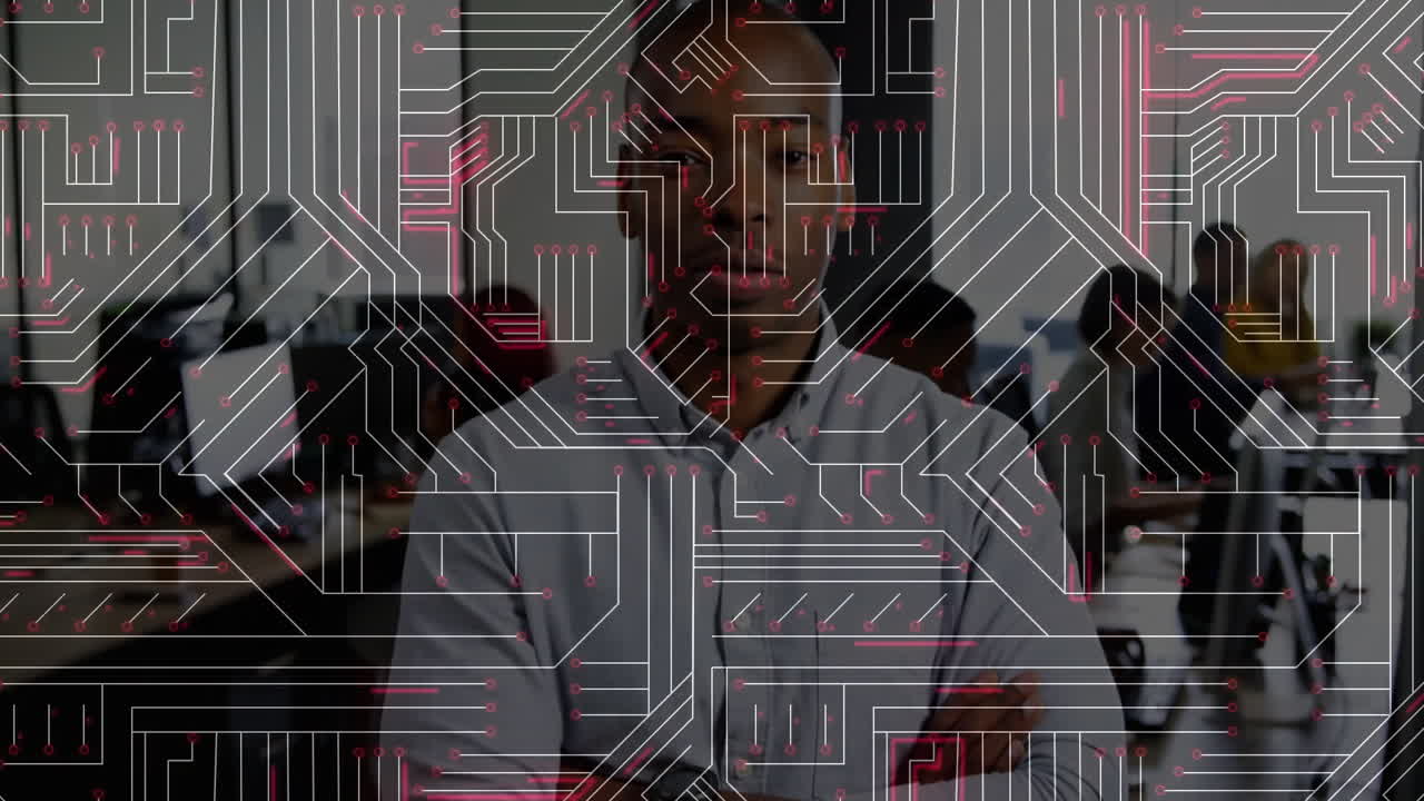 Team collaborating at desks in technology office, displaying animated circuit lines with pink nodes