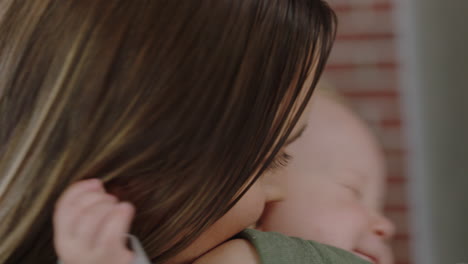 close up young caucasian business woman mother playing with baby daughter at work playful toddler enjoying loving mom successful motherhood in office workplace