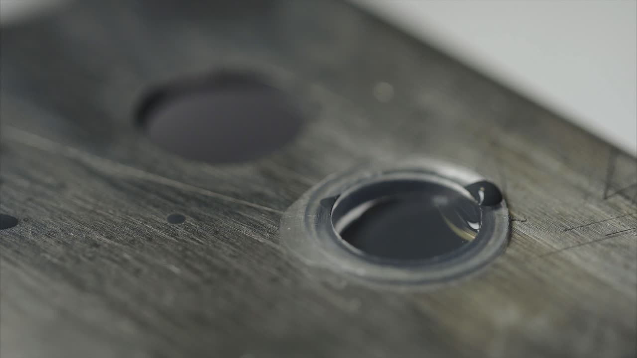 Close-up of audio cassette repair or maintenance process