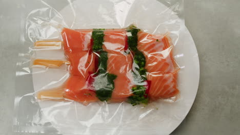 vacuum-sealed salmon skewers with broccoli and peppers