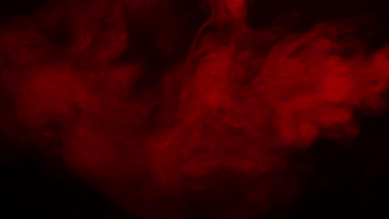 Vero fumo rosso su sfondo nero