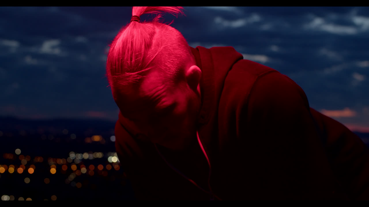 Man in Red Light at Night