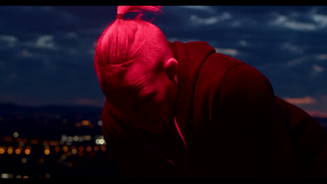 man in red light at night