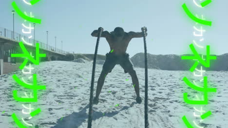 man exercising with battle ropes on beach, fitness animation with green symbols over