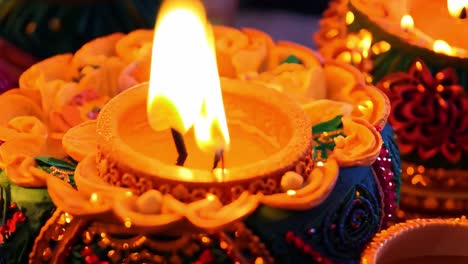 close up of a lit diya candle