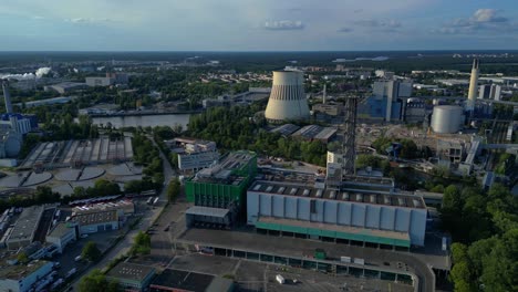 sewage treatment plant in Berlin, featuring circular clarifiers, anaerobic digesters, and other wastewater processing infrastructure. Majestic aerial view flight panorama overview drone