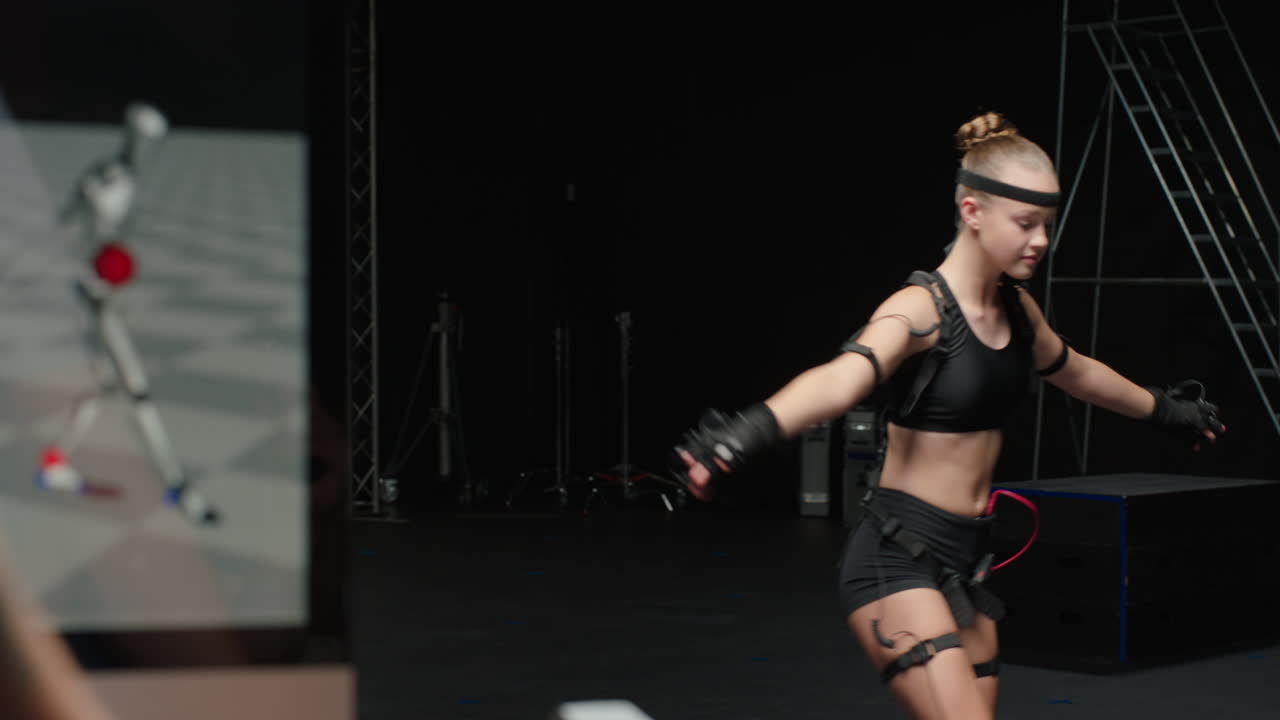 스튜디오에서 모션  ⁇ 처 슈트를 입은 춤추는 여성 발레 댄서 소녀 가상 현실 기술에 대한 3d 캐릭터 애니메이션을 위해 모  ⁇  슈트를 입은 소녀