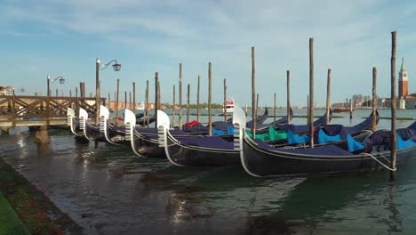 traditional gondolas on canal grande floating on the water canal in venice