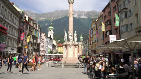 innsbruck austria, circa : timelapse innsbruck town center with lots of people and street cafe in austria.