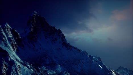 snowy mountain peak at twilight