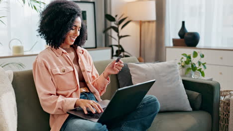 woman using laptop and credit card for online shopping at home