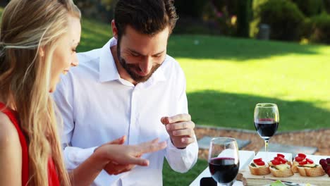 man proposing a woman with a engagement ring 4k