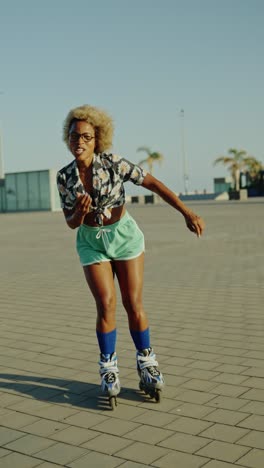 Woman roller skating outdoors blowing a kiss