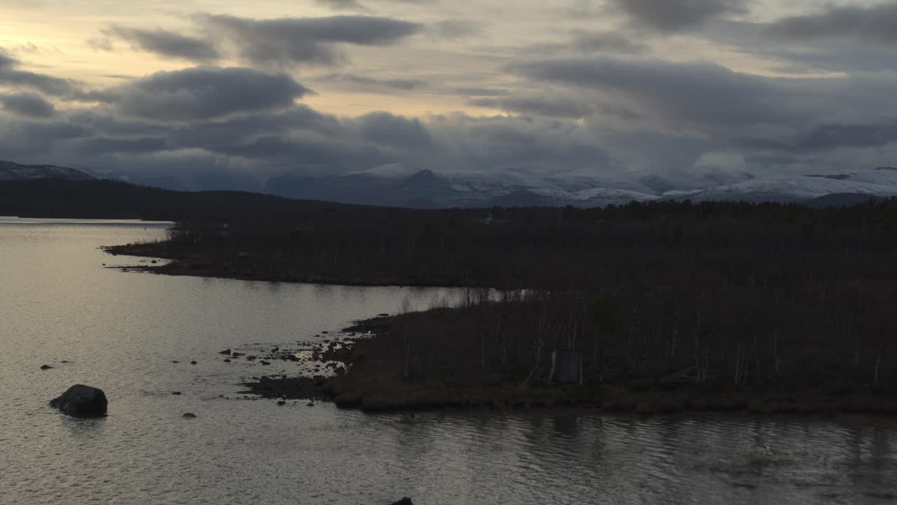 Dramatic Sunset With Overcast Over Mountains And Lake In Sweden
