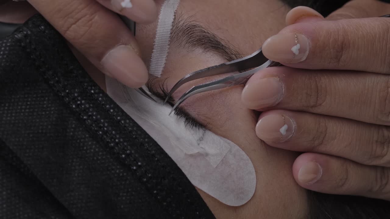 Close up of false eyelash placement on the eye