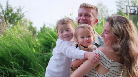 a family shares joyful moments in a beautiful park filled with love in a vibrant park a family captures cherished moments a joyful mother embraces her three children laughter filling the air showcasing their love