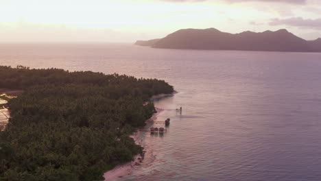 tropical beach on the island of san pablo in hinunangan bay, southern leyte, philippines. - aerial pullback shot