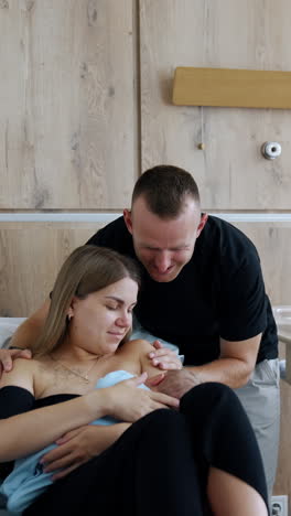 little cute baby with parenthood. new family parents with newborn. vertical video