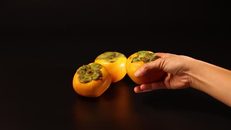 hands interacting with dragon fruit on table