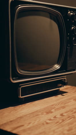 vintage black and white television on wooden table