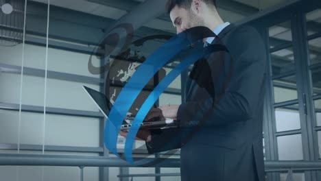 animation of round scanner over spinning globe against caucasian businessman using laptop at office