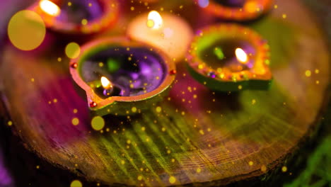 animación de puntos de luz sobre decoraciones de velas de diwali