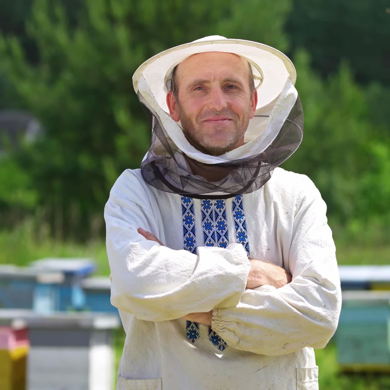 Beekeeper in protective workwear