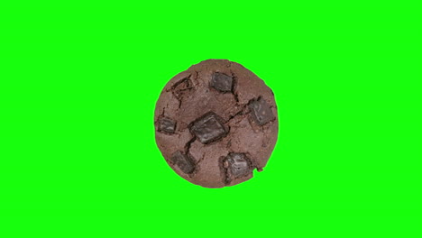 Chocolate-fudge-cookie-spinning-on-green-screen-background-in-top-down-view