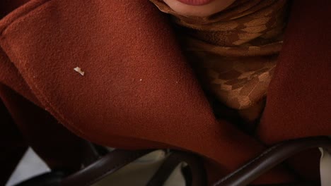 woman drinking coffee outside in autumn weather