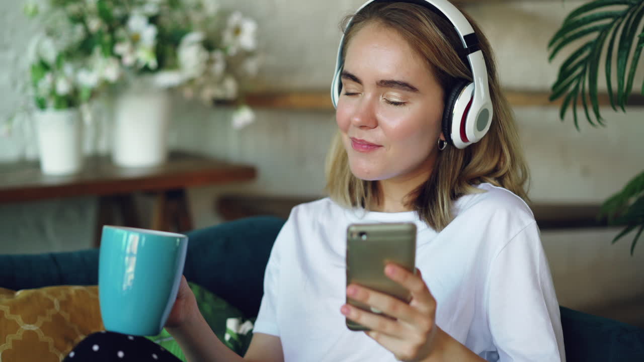 Young Woman Relaxing with Headphones and Phone