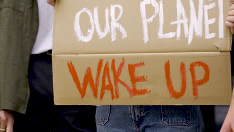 Close-Up-People-With-Megaphone-And-Environment-Board