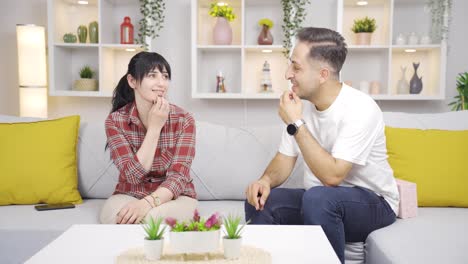 man giving gift to woman.