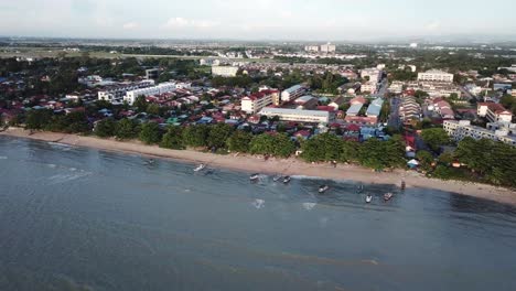 Aerial-view-boats-parking-at-seaside-Bagan-Ajam,-Pantai-Bersih.