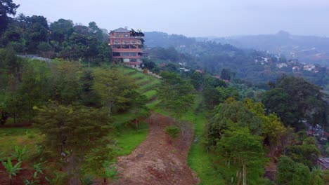 Skyline-Best-View-Resto-comes-out-from-behind-the-trees-in-Northern-Bandung,-Indonesia