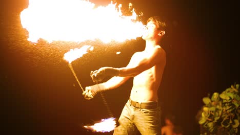 performer displays fire skills in krabi, thailand