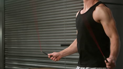 fit man using skipping rope