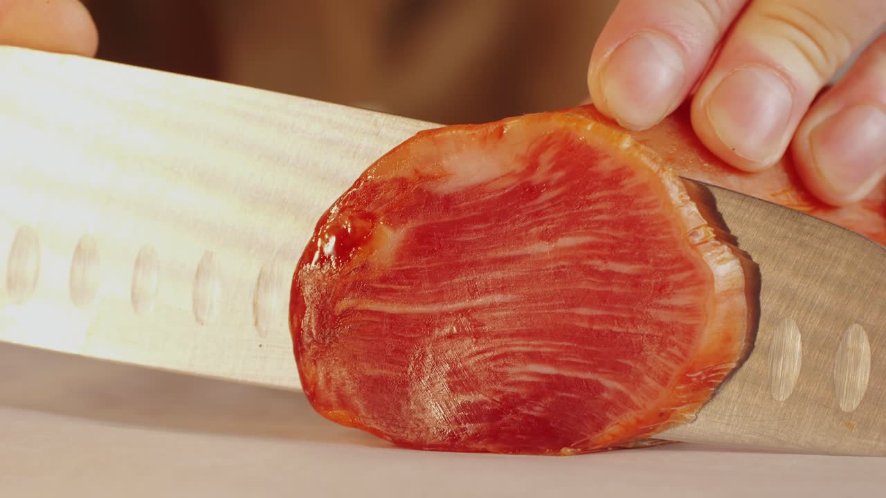 Mix of spanish pork sausages, Cutting board of appetizing catalonian snack - fuet, jamon, chorizo, olives, supermarket tapas food in spain, traditional cuisine.