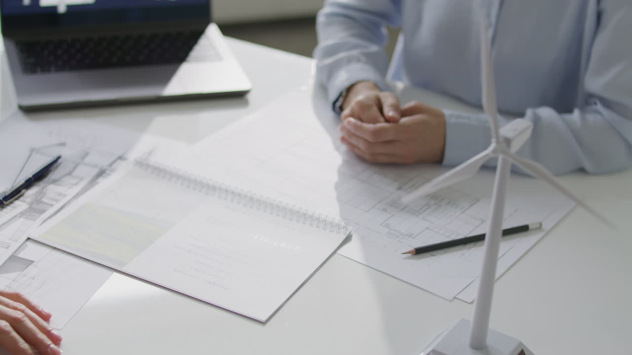 Close Up of Two Engineers Shaking Hands after Discussing Energy Efficiency Plan
