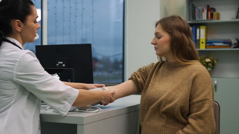 doctor measuring patient's blood pressure