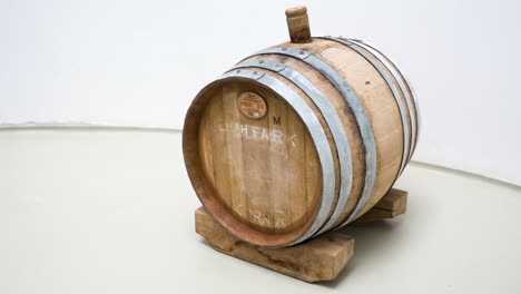 Close-up of a wooden wine barrel in a minimalist setting