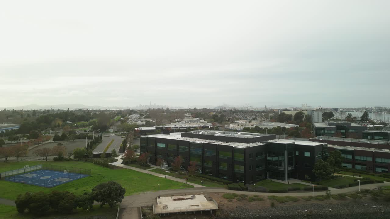 Drone shot over Mariner Square, revealing the vibrant mix of nautical life, peaceful water views, and Alameda's scenic surroundings.