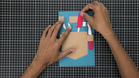 Hands-Creating-a-gift-card-with-a-tool-inspired-theme